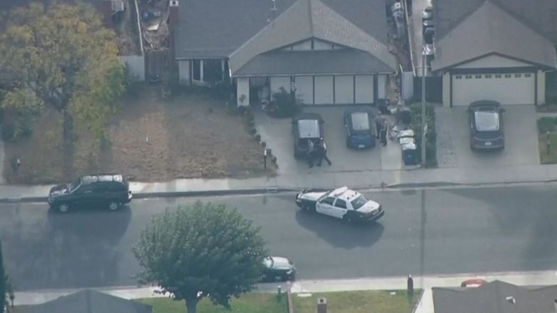 Police surround house after school shooting