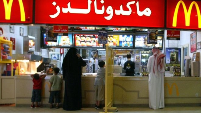 A segregation board separates women and families from men at a McDonalds restaurant in Riyadh