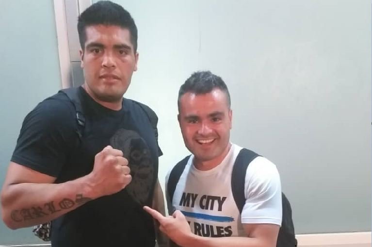 Ariel Baracamonte (L) and his trainer, Claudio Perez, on arrival at the Murtala Mohammed International Airport, Lagos, on Monday