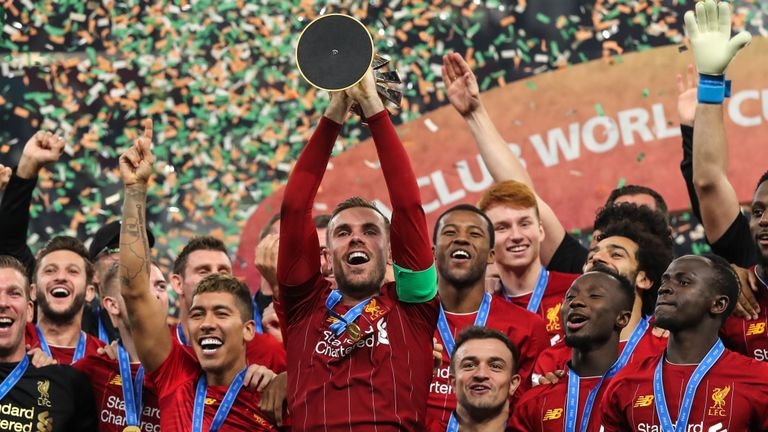 FILE: Liverpool captain Jordan Henderson lifts the Club World Cup trophy