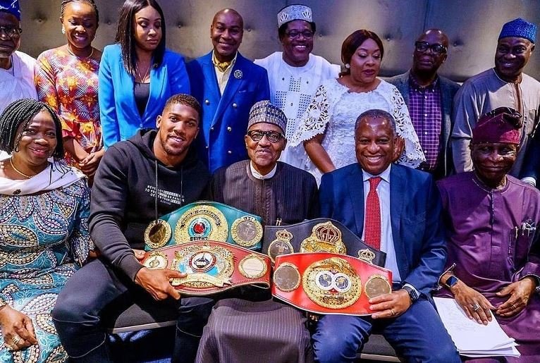 Anthony Joshua presents heavyweight title belts to BuhariAnthony Joshua presents heavyweight title belts to Buhari