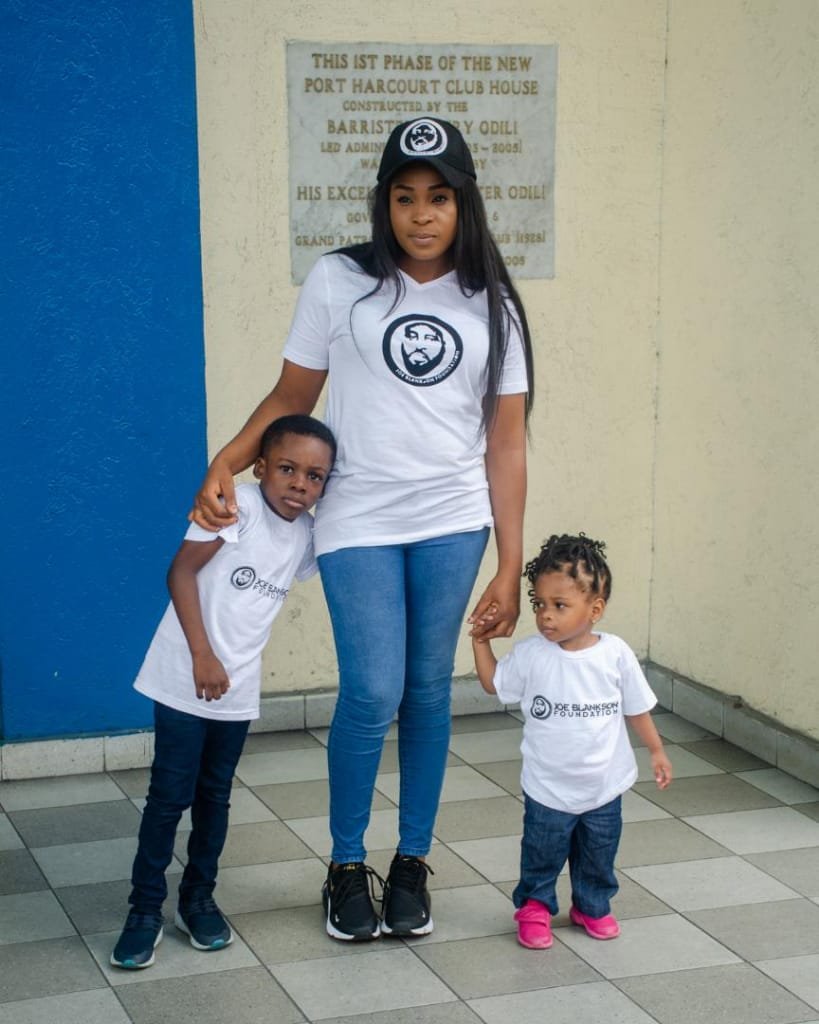 Mrs Blankson and her two children dorning Joe Blankson's memorial shirt