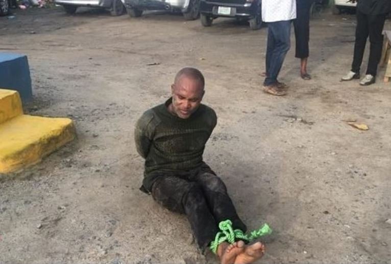 The unidentified policeman strapped at the police station