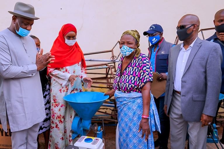 Festus Keyamo (SAN) HMS Labour, Sadiya Umar Farouq, HM, FMHDSD, a trader Mrs. Okolie and DG NEMA, AVM Muhammadu Alhaji Muhammed (Rtd.) during her visit to Ogbeogonogo market Asaba (Source Ministry)