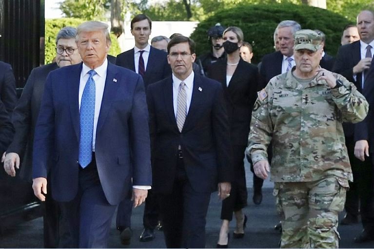 Gen Milley (R) was on the walk with the president, as was Defence Secretary Mark Esper (C)