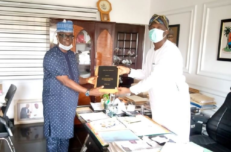 Chairman, Lagos State Polytechnic (LASPOTECH) Visitation Panel, Barr. Adelowo Afolayan (left) presenting the Visitation Panel report to Special Adviser to the Governor on Education, Mr. Tokunbo Wahab (right) on Thursday, June 25, 2020