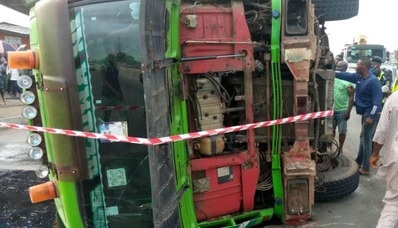 The container fell on a commercial bus killing two persons