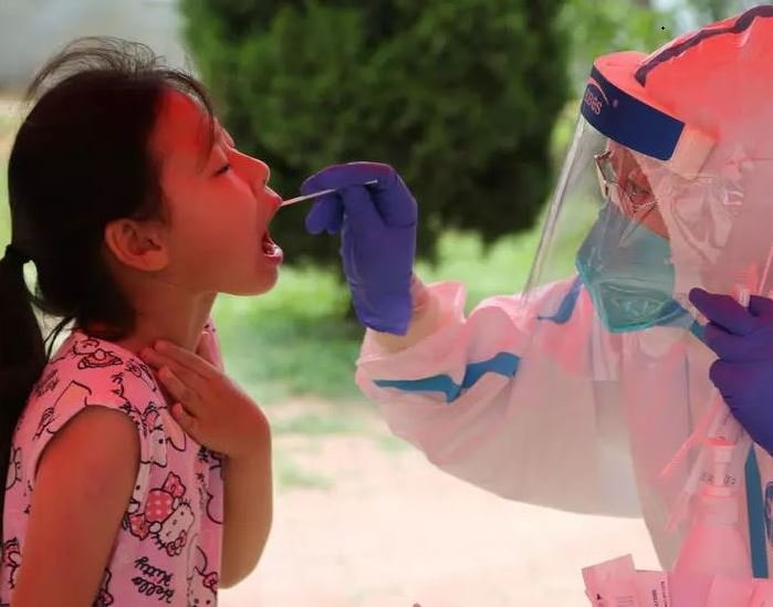 More than three million people have been tested for coronavirus in the northeast city of Dalian, China following the discovery of a cluster of cases at a food processing plant PHOTO: AFP