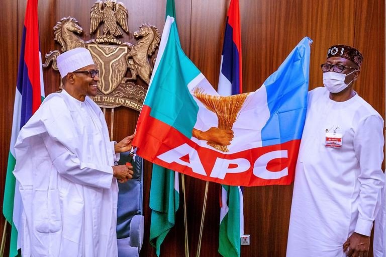 President Muhammadu Buhari presenting the APC party flag to Pastor Osagie Ize-Iyamu pdp