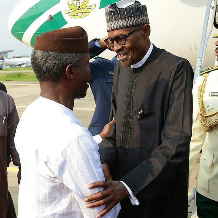 President Muhammadu Buhari shakes Vice President Yemi Osinbajo on his return to Nigeria in 2017