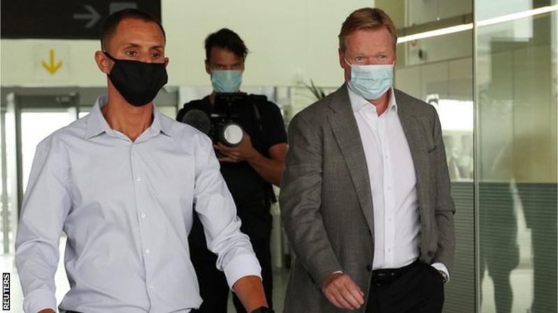 Ronald Koeman (right) arrived at Barcelona's El Prat airport on Tuesday