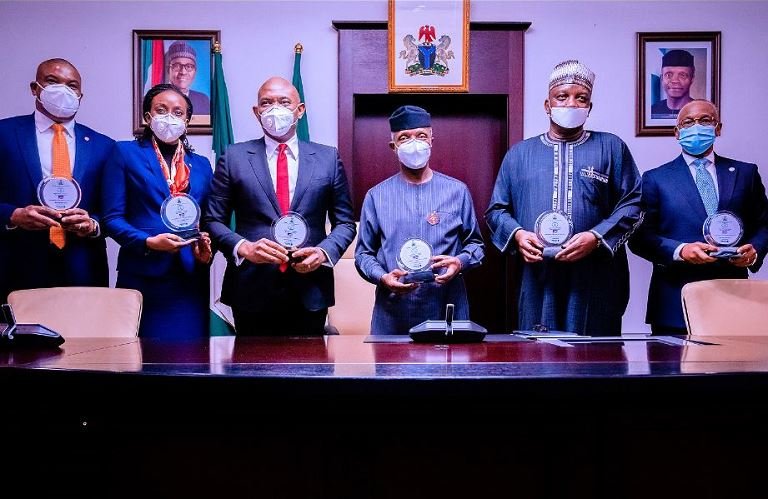 L-R; Vice President Yemi Osinbajo SAN, HM Power Engr. Saleh Mamman, DG BPE Mr. Alex Okoh, Chairman Transcorp Plc Mr. Tony Elumelu, CEO Transcorp Mrs. Owen Omogiafo at the Signing Ceremony of the Share Sale and Purchase Agreements for the Privatization of Afam Power Plc. and Afam Three Fast Power Limited at The State House, Abuja. 5th Nov, 2020.