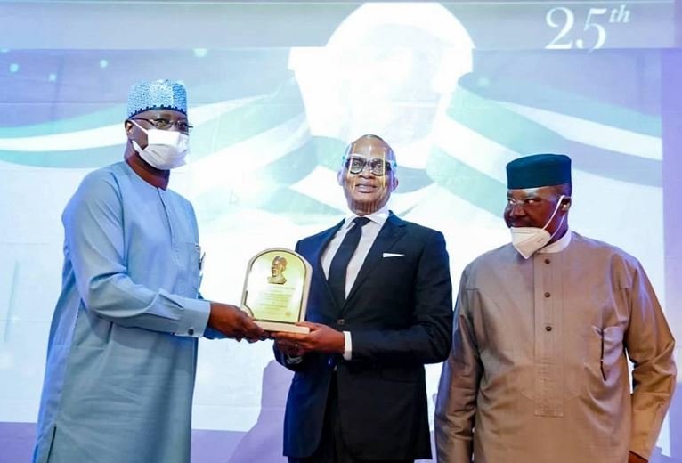 L-R: Secretary to the Government of the Federation, Boss Mustapha; Group Managing Director/CEO, Kennedy Uzoka; Member of Board of Trustees, Public Policy Research and Analysis Centre (PPRAC), organiser of Zik Prize, Marc Wabara, during the conferment of Zik Prize for Professional Leadership on Uzoka in Lagos on Sunday