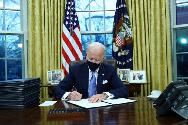 President Biden is quickly signing executive actions on coronavirus, climate change and racial inequality