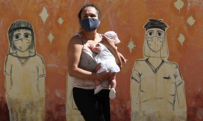 argentina- woman carrying baby