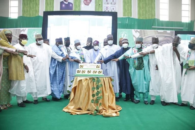 Joined by hundreds of thousands across the world, Asiwaju Bola Tinubu cuts his 69th birthday cake during the 12th BAT Colloquium in Kano
