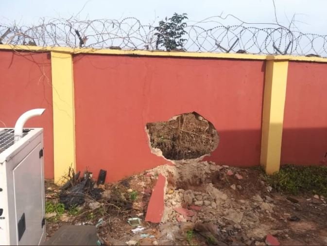 Damaged section of the perimeter fence blown open by the attackers to gain access into INEC office in Anambra State