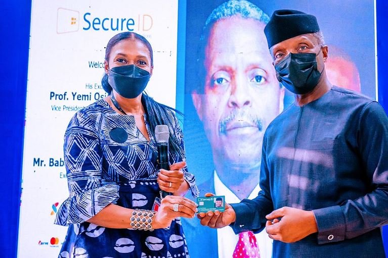 Kofo Akinkugbe, CEO SecureID presents Vice President Yemi Osinbajo with a smart card