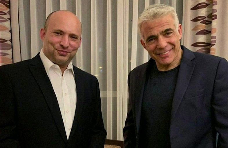 The right-wing Yamina party's Naftali Bennett (left) and Yair Lapid, leader of the centrist Yesh Atid party, after reaching an agreement