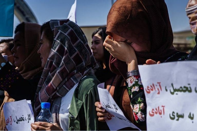 One Afghanistan woman weeps at a protest against the Taliban's interim government being all male