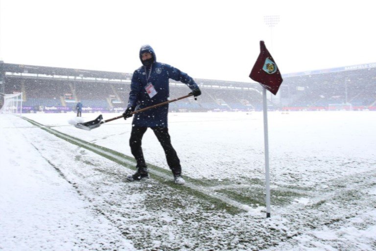 Efforts are on to clear the heavy snow at Burnley's Turf Moor