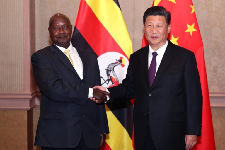 Uganda President Yoweri Museveni shakes hands with his Chinese counterpart Xi Ji-Ping