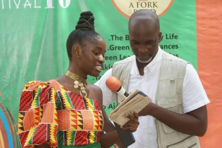 A student read from "First Steps In History" at the Green Festival 2021