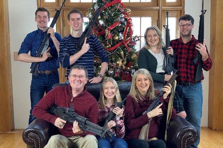 US Rep. Thomas Massie (R-KY) in a Christmas photo of his family holding guns, in this image obtained from Twitter, posted on December 4, 2021