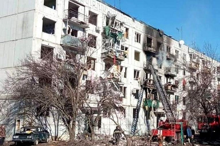A boy died when this block of flats was shelled in north-eastern Ukraine Russia
