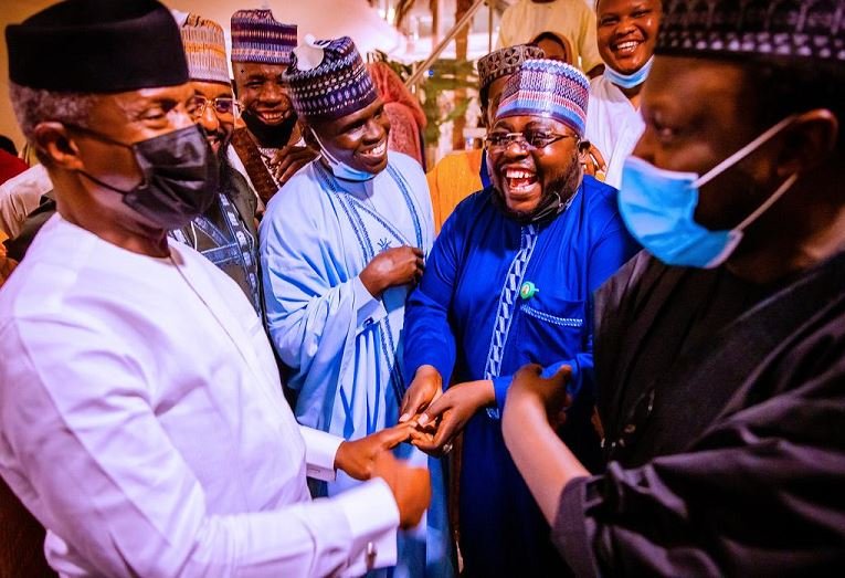 Vice President Yemi Osinbajo shares a laugh with some of the Kannywood actors