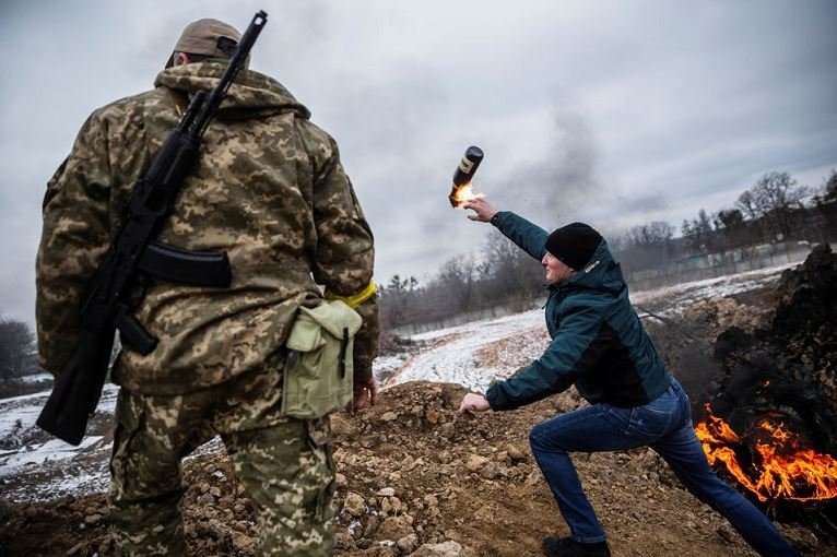 A civilian trains to throw Molotov cocktails to defend the city, as Russia's invasion of Ukraine continues, in Zhytomyr, Ukraine