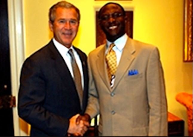 Former US President George H.W. Bush and Mr. Laolu Akande
