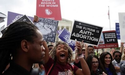 Anti-abortion demonstrators celebrate outside the United States Supreme Court as the court rules in the Dobbs v Women’s Health Organization abortion case, overturning the landmark Roe v Wade abortion decision in Washington, US, June 24, 2022 REUTERS
