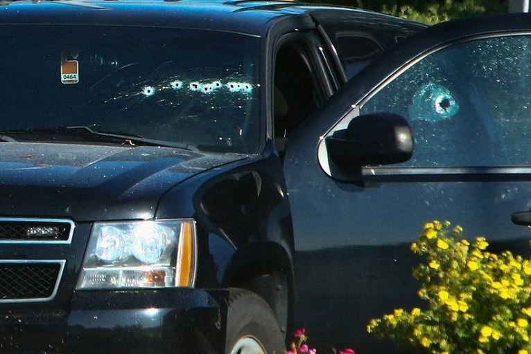 A bullet-riddled vehicle near the shooting site in British Columbia