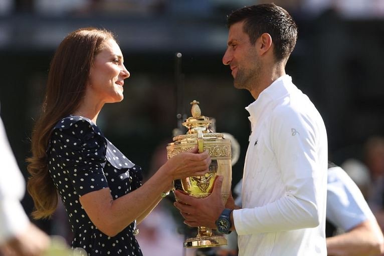 Britain's Catherine, the Duchess of Cambridge presents the trophy to Serbia's Novak Djokovic after he won the men's singles final against Australia's Nick Kyrgios