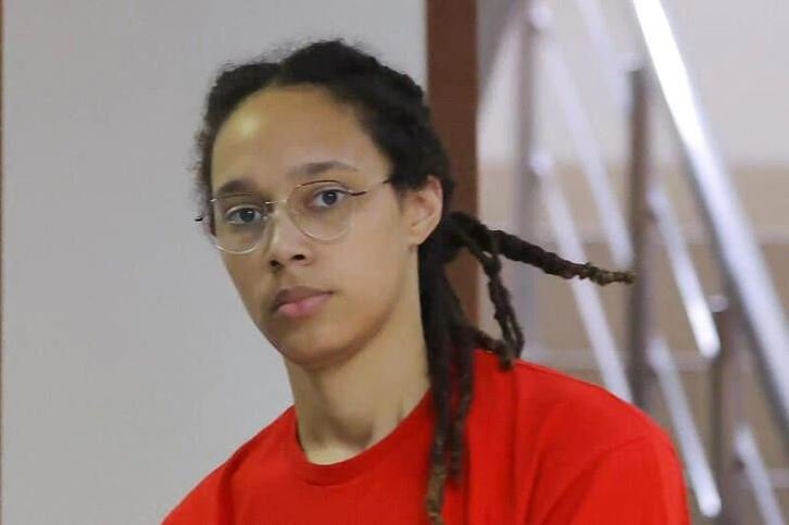 US basketball player Brittney Griner, who was detained in March at Moscow's Sheremetyevo airport and later charged with illegal possession of cannabis, is escorted before a court hearing in Khimki, outside Moscow, Russia.