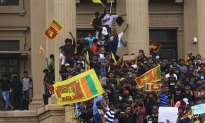 Protesters made their way into the house, chanting slogans and waving the national flag Sri Lanka