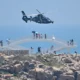 Chinese military helicopters fly past Pingtan Island, one of closest points to Taiwan in mainland China