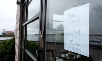 A sign outside Rum Runners sweets shop shows its closure before the arrival of Hurricane Fiona in Halifax, Nova Scotia, Canada