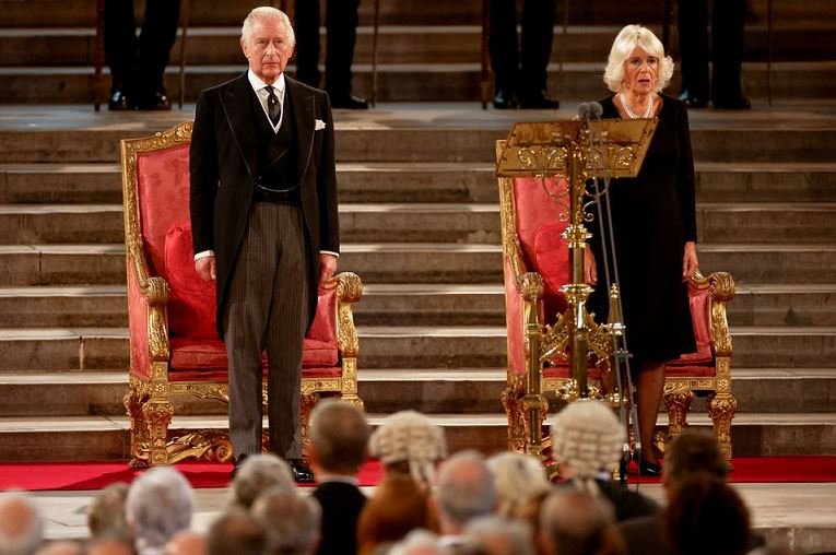 Britain's King Charles and Queen Camilla stand for the national anthem as they visit the parliament in Westminster, following the death of Britain's Queen Elizabeth, in London, Britain, September 12, 2022. REUTERS/John Sibley/Pool