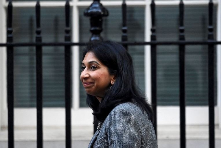 Britain's Secretary of State for the Home Department Suella Braverman walks outside Number 10 Downing Street in London, Britain