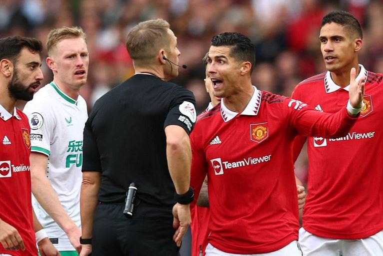 Manchester United's Cristiano Ronaldo reacts before he is shown a yellow card by referee Craig Pawson Newcastle United