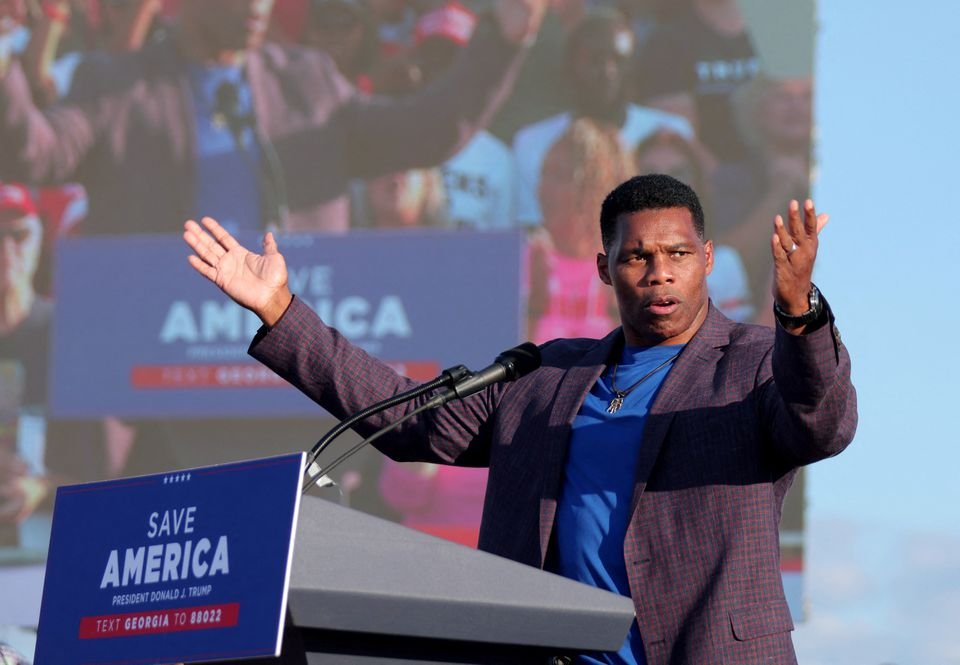 Former college football star and current senatorial candidate Herschel Walker speaks at a rally in Perry, Georgia, U.S. September 25, 2021. REUTERS
