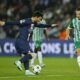 Lionel Messi surrounded by Maccabi Haifa players