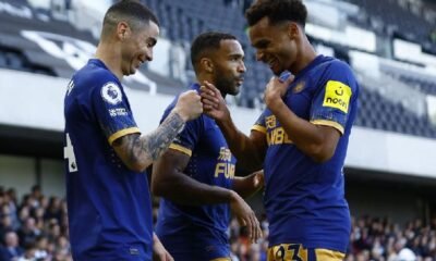 Newcastle United's Miguel Almiron celebrates scoring their fourth goal with Jacob Murphy and Callum Wilson