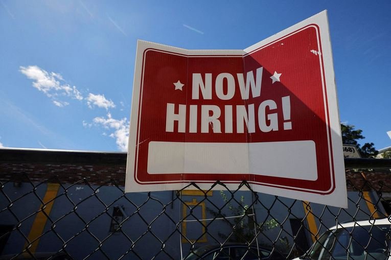A 'now hiring' sign is displayed outside Taylor Party and Equipment Rentals in Somerville, Massachusetts, US REUTERS ILO