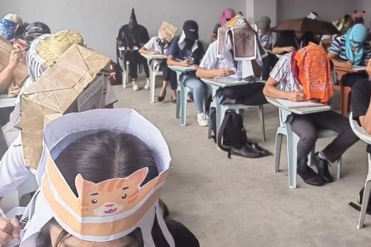 Students were asked to innovate headwear that would block their ability to see their peers' answer papers