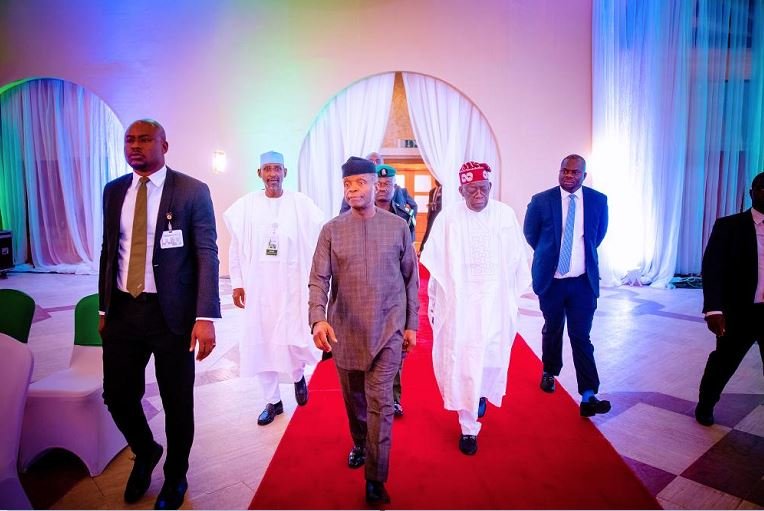 Vice President Yemi Osinbajo flanked by Asiwaju Bola Tinubu and Minister of Federal Capital Territory, Mohammed Musa Bello