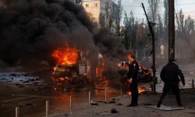 Cars are seen on fire after Russian missile strikes in Kyiv
