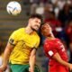 Australia's Mathew Leckie in action with Denmark's Alexander Bah